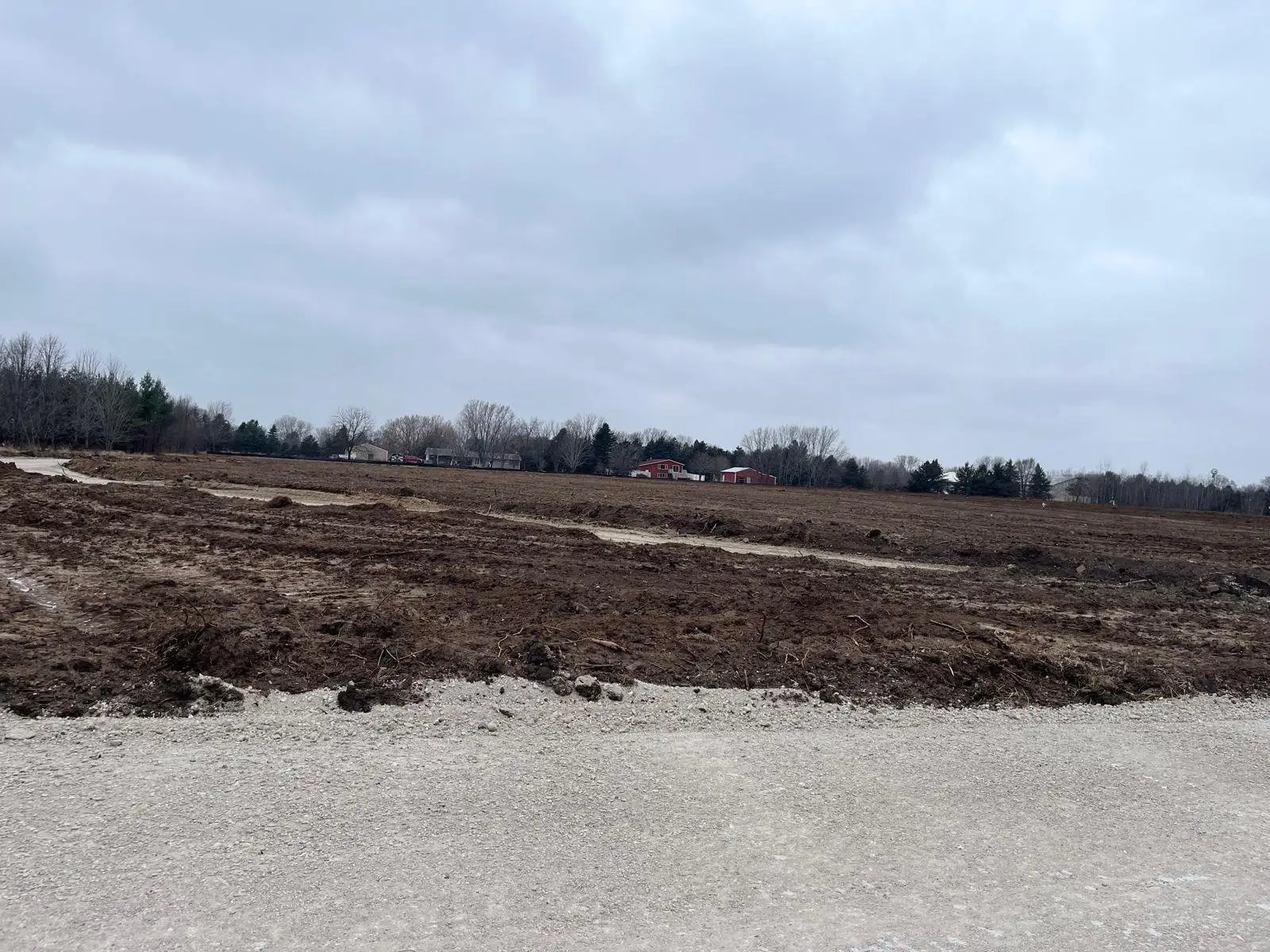 Graders shaping the cemetery roads in March 2025